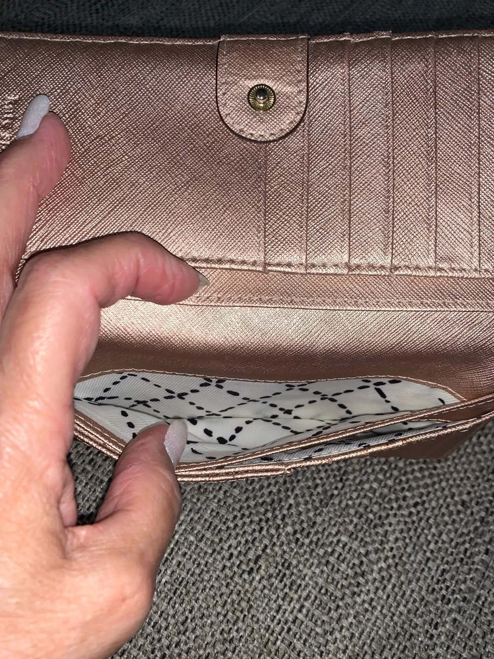 Kate Spade rose gold wallet with callouts